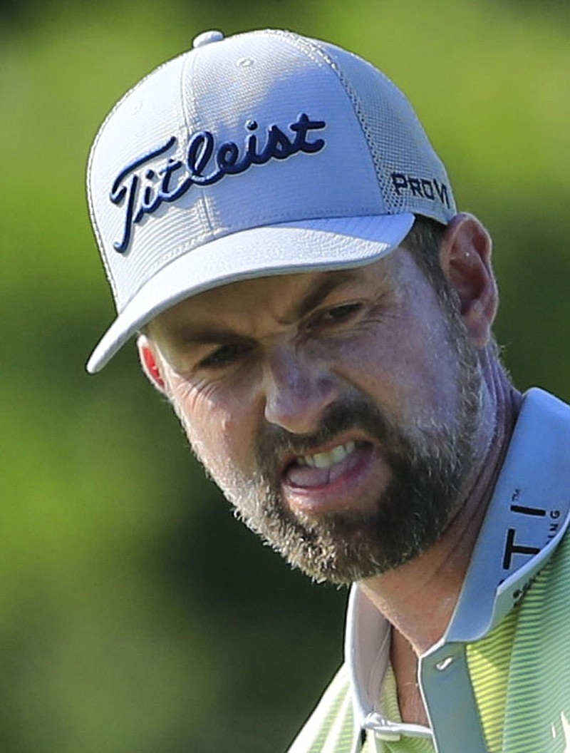 Webb Simpson reacts after missing a putt on the 12th green during the first round of the Sony Open golf tournament Thursday, Jan. 14, 2021, at Waialae Country Club in Honolulu. (AP Photo/Jamm Aquino)