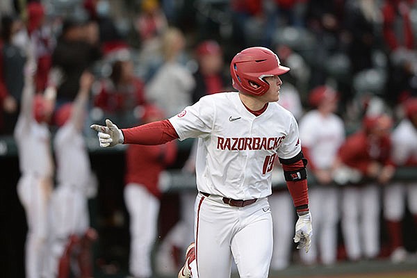 Arkansas designated hitter Charlie Welch reacts after hitting a home run during a game against Southeast Missouri State on Friday, Feb. 26, 2021, in Fayetteville.