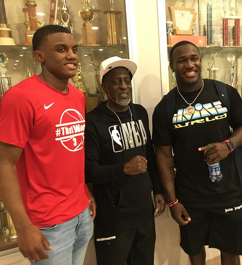 NFL linebacker Devin White (right) of the Super Bowl Champions Tampa Bay Buccaneers poses for a pitcure with Magnolia junior Derrian Ford (left) and Earnest Standoak (center) of Waldo. White played high school football at North Webster in Springhill, La., and for the LSU Tigers in college. He was the fifth overall pick in the 2019 NFL draft. He was at Panther Arena Wednesday night watching Ford and the top-ranked Panthers (18-0) defeat Camden Fairview. (Banner-News/Chris Gilliam)