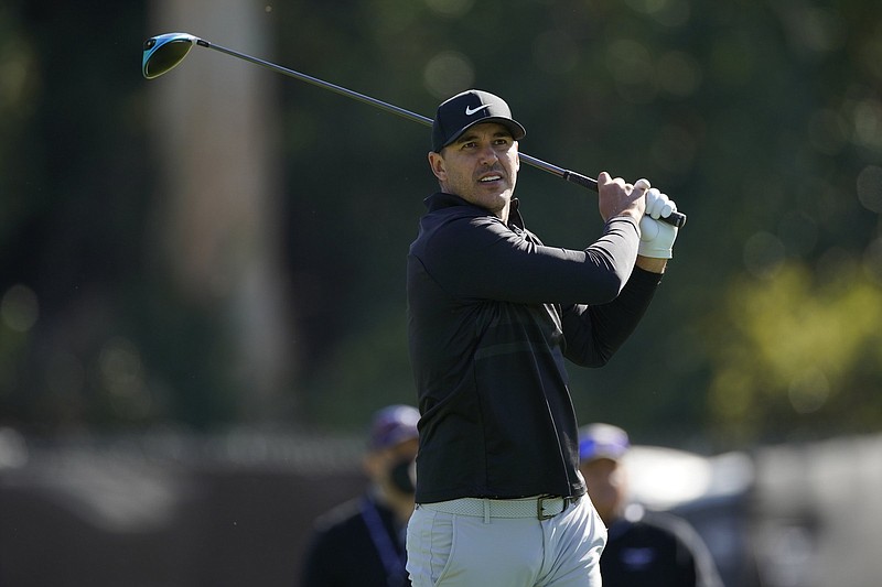 Brooks Koepka tees off on the second hole during the third round of the Genesis Invitational golf tournament at Riviera Country Club, Saturday, Feb. 20, 2021, in the Pacific Palisades area of Los Angeles. (AP Photo/Ryan Kang)