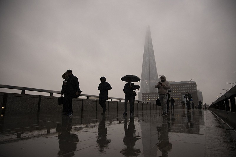 Commuters cross London Bridge in the City of London on Feb. 15, 2021. MUST CREDIT: Bloomberg photo by Jason Alden.