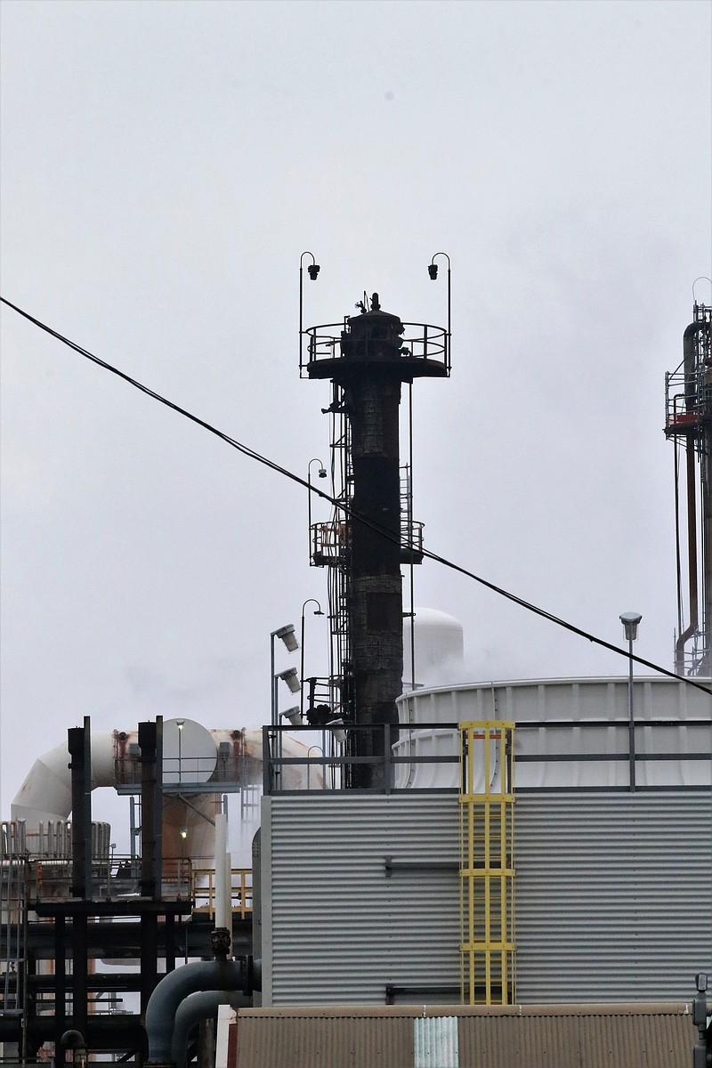 A blackened tower at the Delek: El Dorado Refinery, formerly known as Lion Oil, is hosed down. A fire broke out at the refinery Saturday and the cause was still unknown Sunday evening. (Courtesy of Penny Chanler)