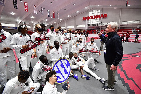 Arkansas coach Chris Bucknam (right) speaks to his team after the Razorbacks won the title at the SEC Indoor Championships on Saturday, Feb. 27, 2021, in Fayetteville. Arkansas coach Chris Bucknam (right) speaks to his team after the Razorbacks won the title at the SEC Indoor Championships on Saturday, Feb. 27, 2021, in Fayetteville.