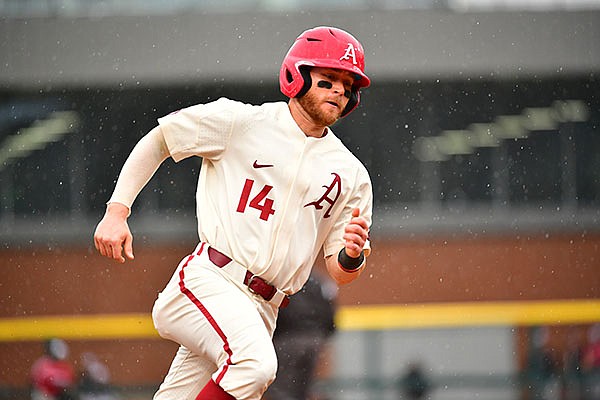 Arkansas' Cullen Smith runs toward home plate during a game against Southeast Missouri State on Sunday, Feb. 28, 2021, in Fayetteville. Arkansas' Cullen Smith runs toward home plate during a game against Southeast Missouri State on Sunday, Feb. 28, 2021, in Fayetteville.