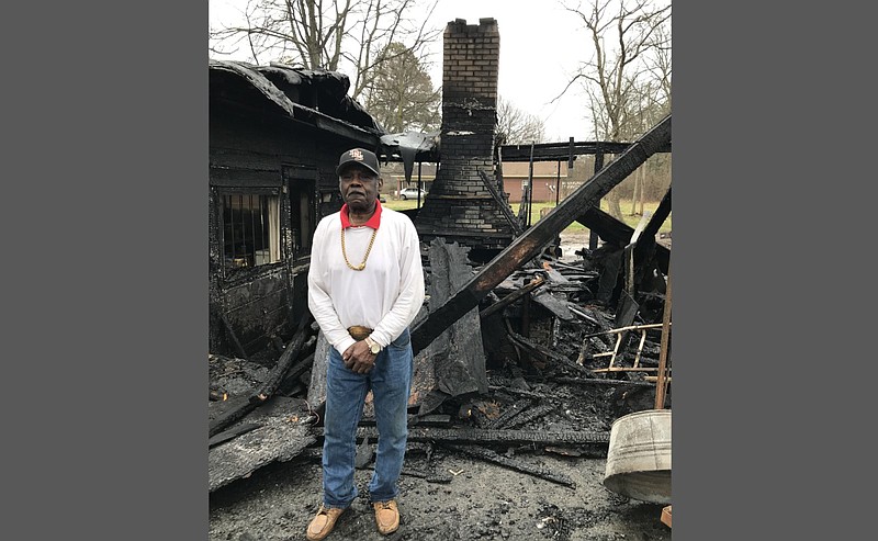 James Harold Jones, the owner of Jones Bar-B-Que Diner in Marianna, stands Sunday, Feb. 28, 2021, by the restaurant’s pit area, which was destroyed by fire that morning. The restaurant building itself was partially damaged, he said. (Steve Higginbothom/Special to the Arkansas Democrat-Gazette)