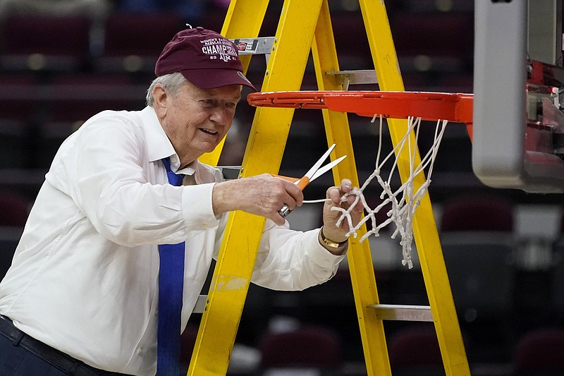 Texas A&M head coach Gary Blair cuts down the net after a  win over South Carolina in an NCAA college basketball game Sunday, Feb. 28, 2021, in College Station, Texas. (AP Photo/Sam Craft)
