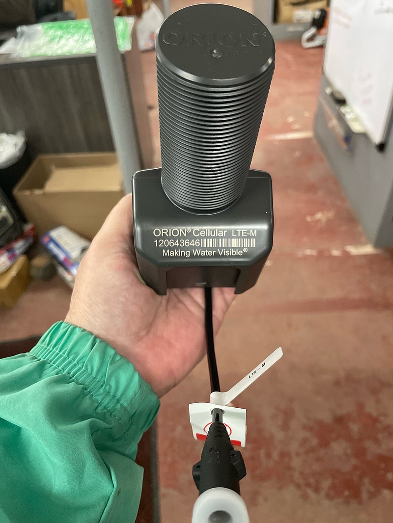 Public Works Director Robert Edmonds shows a transmitter for the city’s cellular-based water meters. The transmitters will become obsolete soon and several groups are working together to come up with a plan to address the matter, including possibly pursuing legal action. (Contributed)