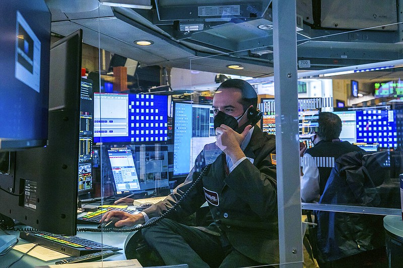 In this photo provided by the New York Stock Exchange, traders work on the floor, Monday, March 1, 2021.
