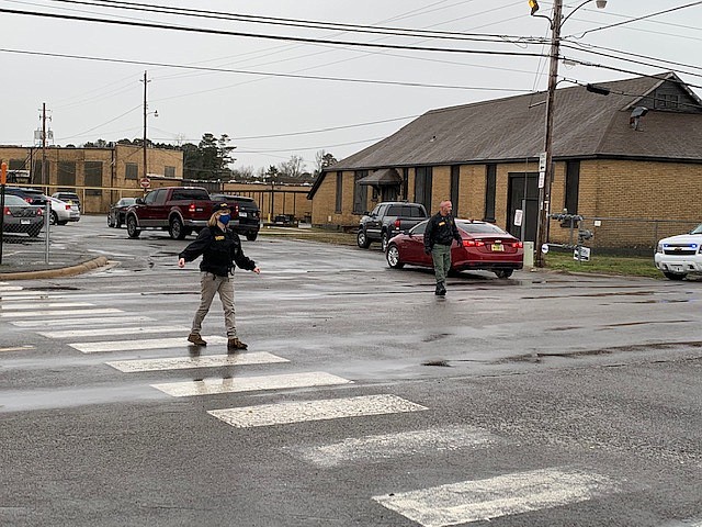 Authorities work near the scene of a shooting at Watson Chapel Junior High School in Pine Bluff on Monday.