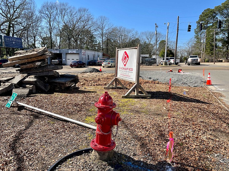 Diversified workers could be seen on Jan. 27 building a new turn lane at the intersection of College Avenue and Fifth Street. The work is part of a larger project to widen Fifth Street. (Marvin Richards/News-Times)