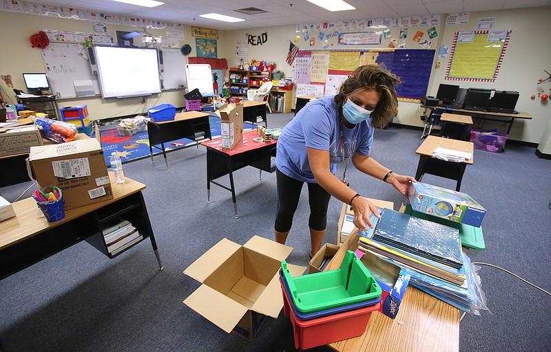 August 18 - Teachers prep classrooms prior to school starting - - - Second grade teacher Stacie Mitchell unloads learning materials from boxes on Tuesday, Aug. 18, 2020, at Chicot Elementary School in Little Rock. .(Arkansas Democrat-Gazette/Thomas Metthe)