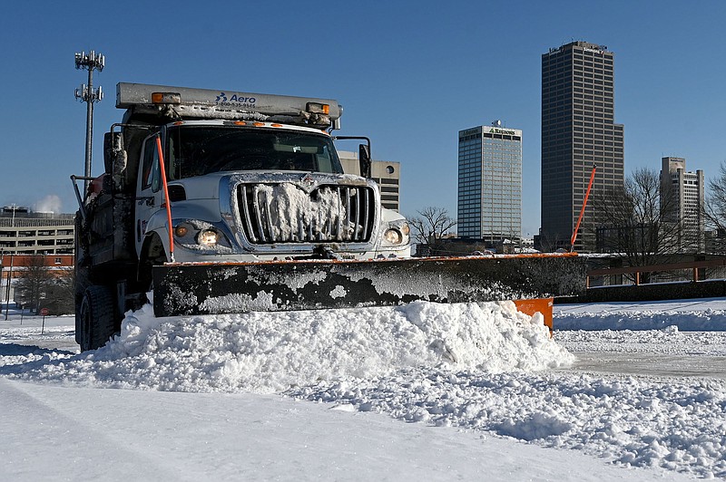 February 16, 2021 - Major Winter storm disrupts vaccine schedule  - - - A snowplow clears snow off of S. Chester Street in downtown Little Rock on Tuesday, Feb. 16, 2021. See more photos at arkansasonline.com/217snow/..(Arkansas Democrat-Gazette/Stephen Swofford)