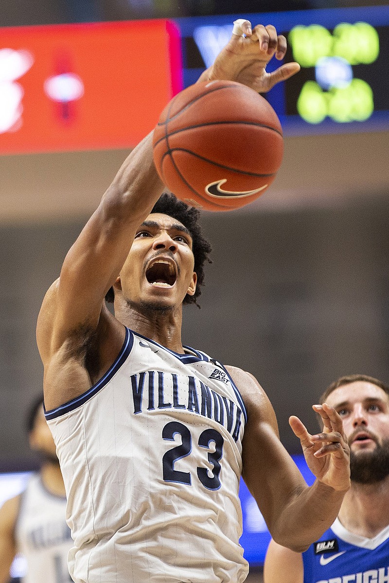 Villanova forward Jermaine Samuels (23) dunks during the first half of the team's NCAA college basketball game against Creighton, Wednesday, March 3, 2021, in Villanova, Pa. (AP Photo/Laurence Kesterson)