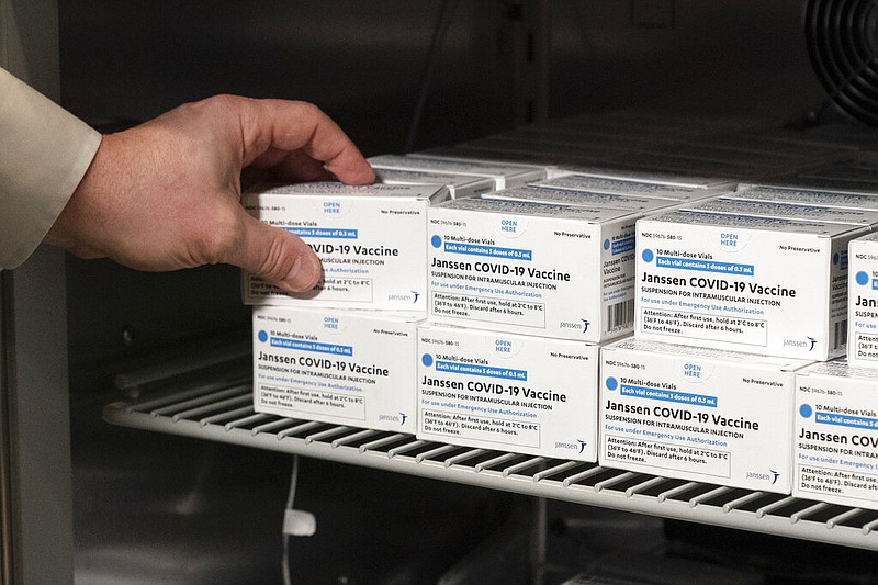 Pharmacist Jack Kann places boxes of the Johnson & Johnson covid-19 vaccine into a refrigerator at South Shore University Hospital in Bay Shore, N.Y., on Wednesday, March 3, 2021. Janssen Pharmaceuticals is a division of Johnson & Johnson. (AP/Mark Lennihan)