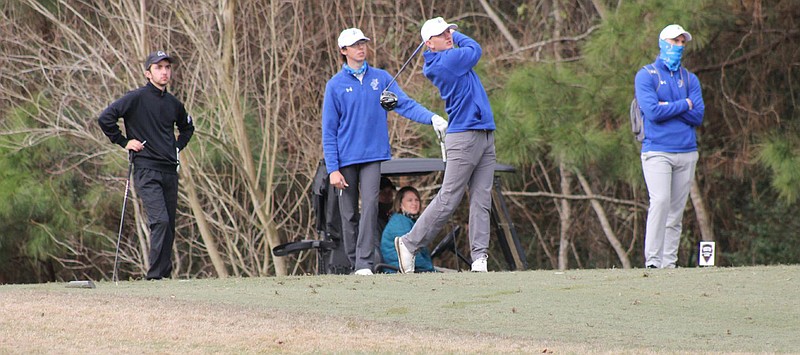 SAU’s Connor Harrington of Magnolia swings the club, while teammate Caleb Miller of Cabot (second from left) looks on during golf action Tuesday. The Muleriders will compete in the Battle of the Belt event Monday and Tuesday in Hot Springs. The tournament is being hosted by Henderson State. (SAU Sports)