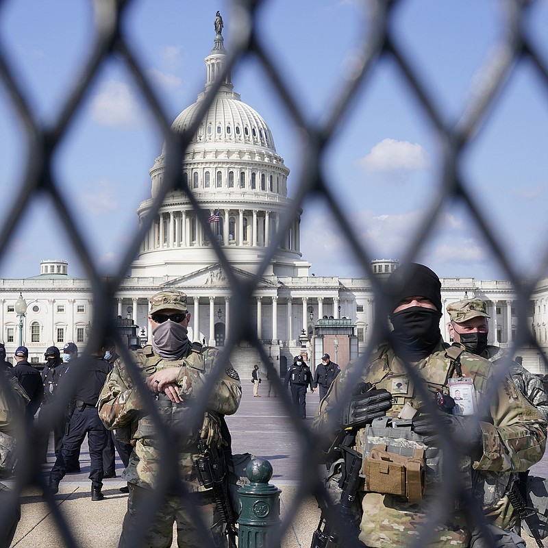 National Guard keep watch on the Capitol, Thursday, March 4, 2021, on Capitol Hill in Washington. Capitol Police say they have uncovered intelligence of a "possible plot" by a militia group to breach the U.S. Capitol on Thursday, nearly two months after a mob of supporters of then-President Donald Trump stormed the iconic building to try to stop Congress from certifying now-President Joe Biden's victory. (AP Photo/Jacquelyn Martin)