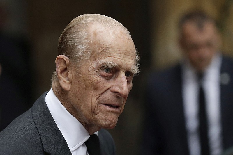 FILE - In this Tuesday, June 27, 2017 file photo, Britain's Prince Philip leaves St Paul's Church in Knightsbridge, London. Senior royals are congratulating Prince Philip as the husband of Queen Elizabeth II celebrates his 98th birthday in private. In a tweet Monday June 10, 2019, the royal family wished Philip "a very happy" birthday. (AP Photo/Matt Dunham, file)