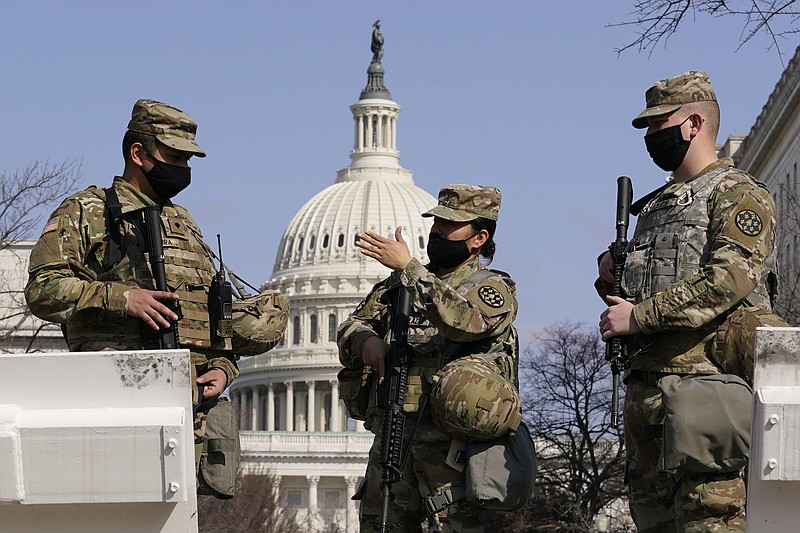 National Guard stand guard at the Capitol in Washington, Thursday, March 4, 2021. (AP Photo/Carolyn Kaster)