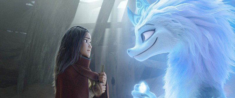 Raya (voiced by Kelly Marie Tran) is a young warrior princess training to become a Guardian of the Dragon Gem when she encounters Sisu (Awkwafina), a goofy young water dragon who can assume human shape in Disney’s “Raya and the Last Dragon.