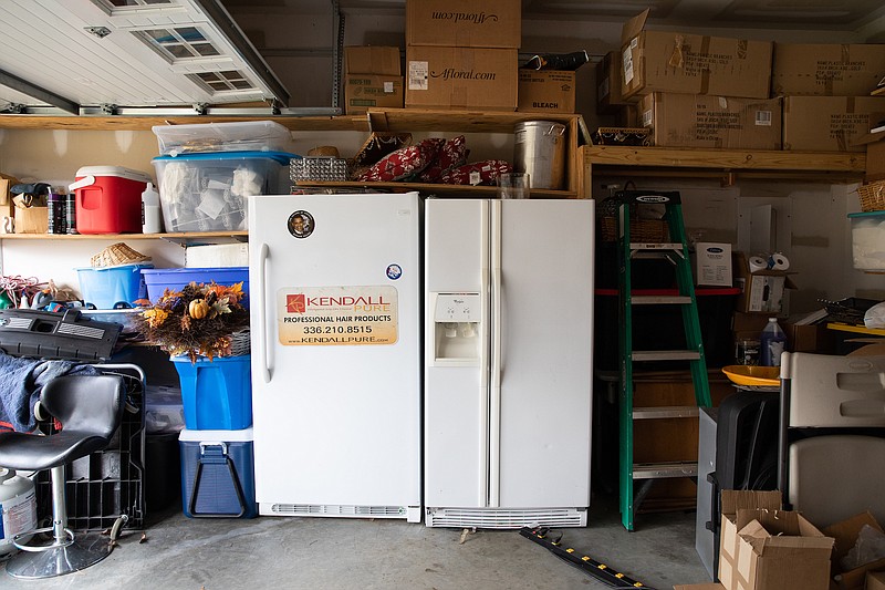 A refrigerator and freezer have a home in the garage of Robyn Penniegraft. For many Americans, a second fridge — and sometimes a third — is like another member of the family. (The New York Times/Swikar Patel)