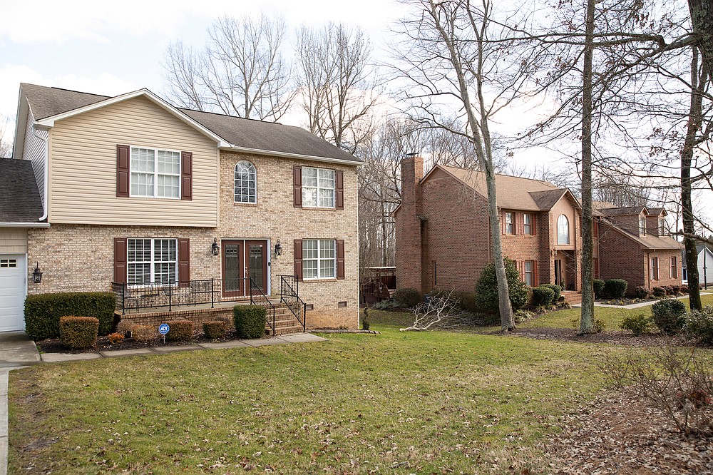 Robyn Penniegraft's home, left, is next to that of her parents in Greensboro, N.C. (The New York Times/Swikar Patel)