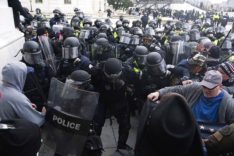 In this Jan. 6, 2021, file photo, U.S. Capitol Police push back rioters trying to enter the U.S. Capitol in Washington. (AP/Jose Luis Magana)