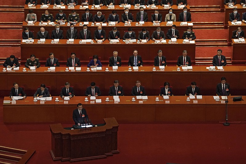 Chinese Premier Li Keqiang delivers a speech during the opening session of China's National People's Congress (NPC) at the Great Hall of the People in Beijing, Friday, March 5, 2021. China’s No. 2 leader has set a healthy economic growth target and vowed to make this nation self-reliant in technology amid tension with Washington and Europe over trade and human rights. (AP Photo/Andy Wong)