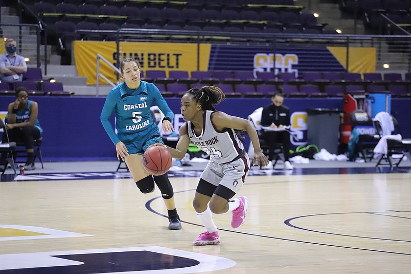 UALR guard Mayra Caicedo (right) dribbles the ball Friday while being defended by Coastal Carolina guard Deaja Richardson during the Trojans’ 75-64 victory over the Chanticleers in the first round of the Sun Belt Conference Tournament in Pensacola, Fla.
(Photo courtesy UALR Athletics)