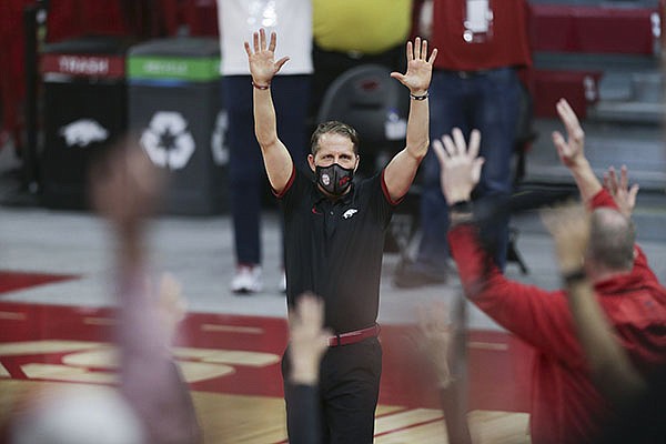 Arkansas coach Eric Musselman leads a Hog Call following the Razorbacks' 87-80 victory over Texas A&M on Saturday, March 6, 2021, in Fayetteville.