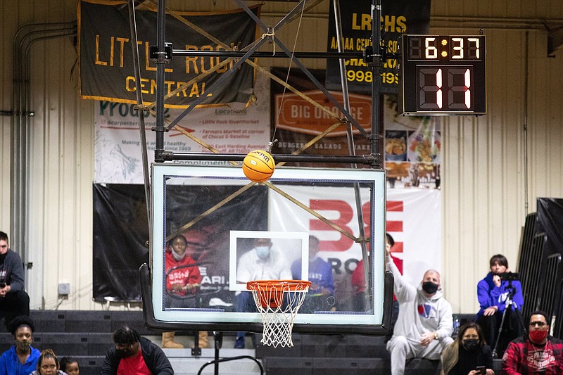 A shot is taken as the shot clock counts down Tuesday night at Little Rock Central gym in Little Rock. (Arkansas Democrat-Gazette/Justin Cunningham)