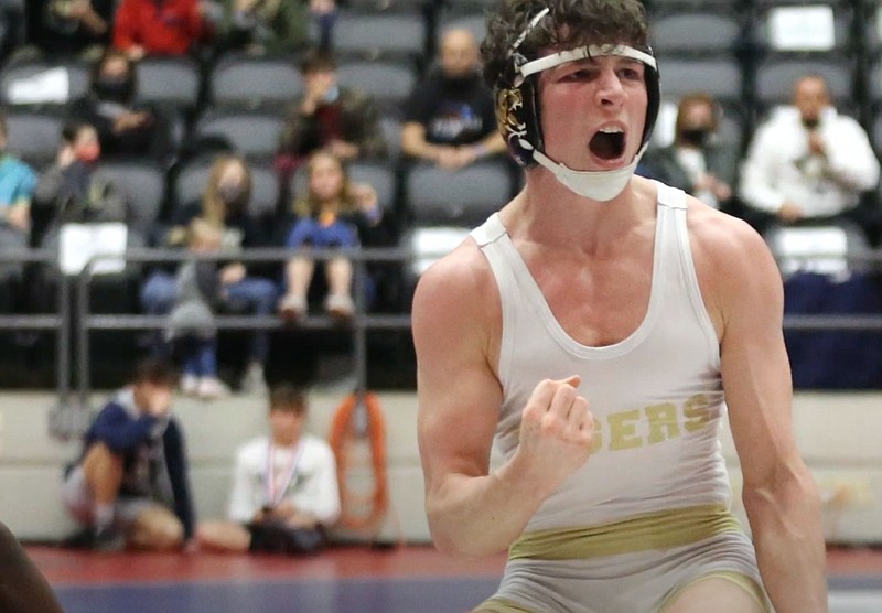 Bentonville's Jacob Adams (right) celebrates after beating Little Rock Central's Gary Walker to win the Class 6A 138 weight class state championship on Friday, March 5, 2021, during the State Wrestling Tournament at the Jack Stephens Center in Little Rock.