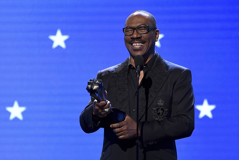 FILE - In this Jan. 12, 2020, file photo, Eddie Murphy accepts the lifetime achievement award at the 25th annual Critics' Choice Awards in Santa Monica, Calif.  Murphy will be inducted into the NAACP Image Awards Hall of Fame this month. The NAACP announced Thursday, March 11, 2021, that Murphy will be inducted during the March 27 ceremony, which will air on CBS. (AP Photo/Chris Pizzello, File)