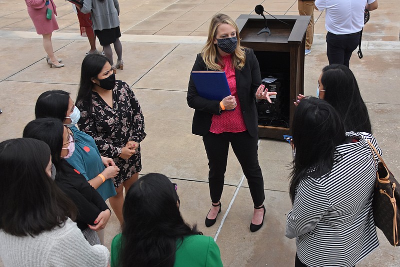 Rep. Megan Godfrey, D-Springdale, talks with DACA teachers at the Capitol Building on Thursday, March 11, 2021 after a press conference celebrating the success of House Bill 1451, a bill that allows dual immersion or bilingual programs in K-12 public schools, and House Bill 1594, a bill to amend the laws concerning teaching licenses. See more photos at arkansasonline.com/312daca/..(Arkansas Democrat-Gazette/Staci Vandagriff)