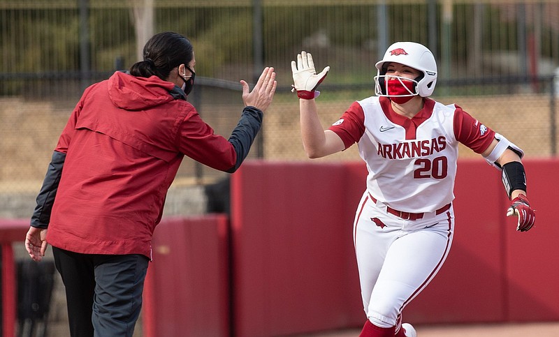 Arkansas left fielder Hannah Gammill (right) is congratulated by Coach Courtney Deifel after a home run during a recent game. Gammill is among a handful of players who are out for the Razorbacks as they begin a three-game set with South Carolina today.
(Special to NWA Democrat-Gazette/David Beach) Arkansas left fielder Hannah Gammill (right) is congratulated by Coach Courtney Deifel after a home run during a recent game. Gammill is among a handful of players who are out for the Razorbacks as they begin a three-game set with South Carolina today.
(Special to NWA Democrat-Gazette/David Beach)