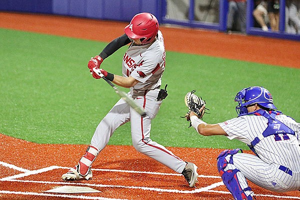 Arkansas designated hitter Matt Goodheart hits a home run during a game against Louisiana Tech on Friday, March 12, 2021, in Ruston, La.