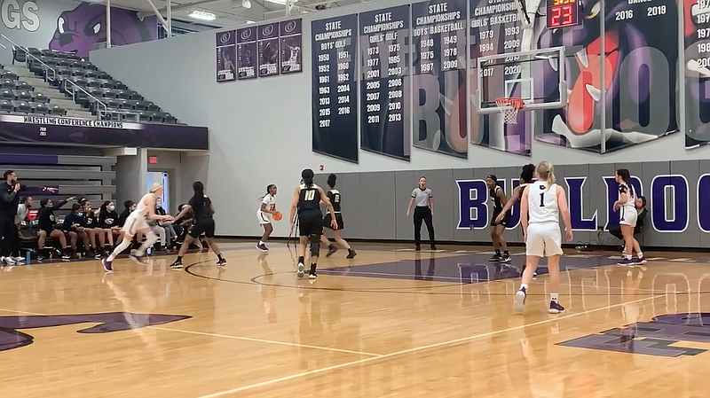 The Lady Purple’Dogs held off an early second-half challenge and advanced to Saturday’s Class 6A semifinals.