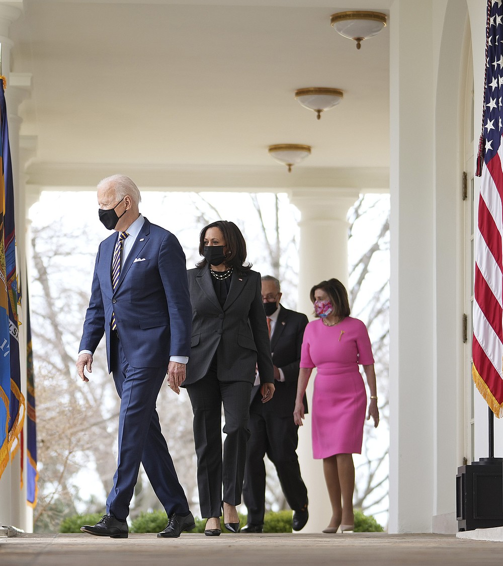 Democratic leaders President Joe Biden (from left), Vice President Kamala Harris, Senate Majority Leader Charles Schumer and House Speaker Nancy Pelosi arrive Friday in the Rose Garden to remark on the American Rescue Plan. “It’s going to require fastidious oversight to make sure there’s no waste or fraud and the law does what it’s designed to do,” Biden said. (The New York Times/Doug Mills)