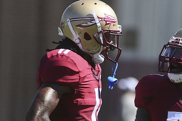 Florida State wide receiver Warren Thompson (11) is shown during an NCAA college football preseason practice Sunday, Aug. 4, 2019, in Tallahassee, Fla. (AP Photo/Phil Sears)