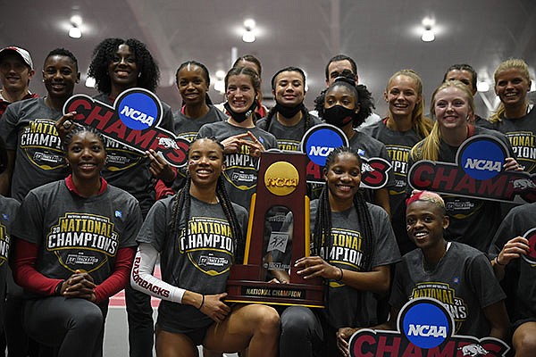 Members of Arkansas' track and field team celebrate their NCAA indoor championship on Saturday, March 13, 2021, in Fayetteville. Members of Arkansas' track and field team celebrate their NCAA indoor championship on Saturday, March 13, 2021, in Fayetteville.