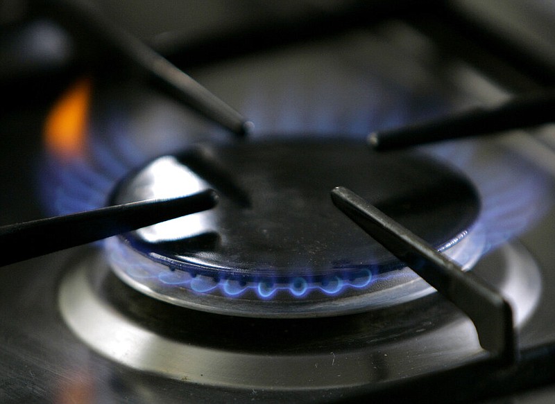 A gas-lit flame burns on a natural gas stove in this Jan. 11, 2006, file photo. (AP/Thomas Kienzle)