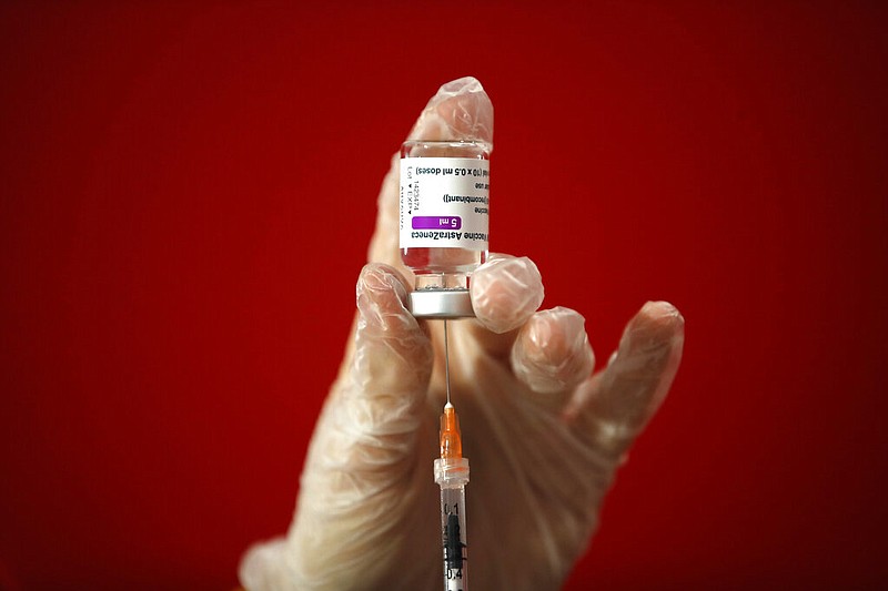 FILE - In this Monday, March 8, 2021 file photo a health worker shows the media how she prepares a dose of the AstraZeneca vaccine to be administered to a patient at a vaccination center set up in front of Rome's Termini central station. (AP/Alessandra Tarantino, File)