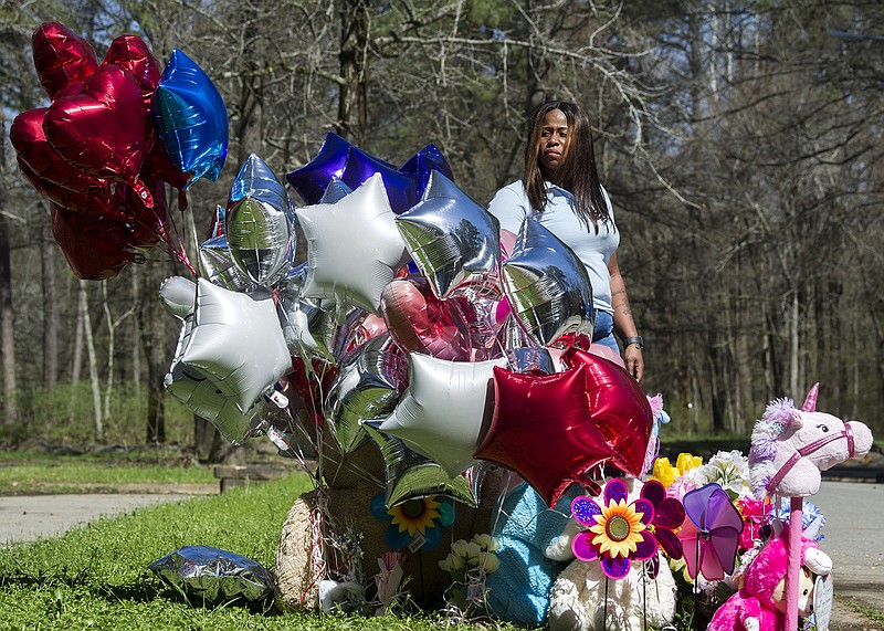 Yuquitia Bradley visits a memorial for her daughter, Ja’Aliyah Hughes, in Little Rock's Boyle Park on Monday, March 15, 2021. Hughes was killed in the crossfire when an argument in the park led to gunfire on Saturday, March 13. See more photos at arkansasonline.com/316memorial/. (Arkansas Democrat-Gazette/Stephen Swofford)