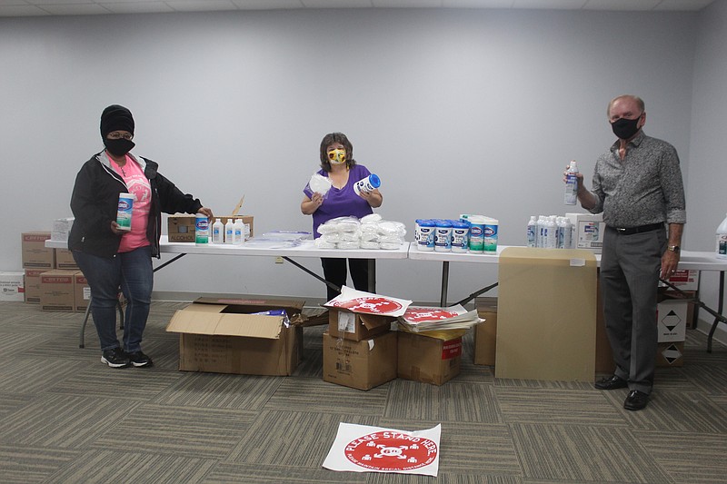 In this News-Times file photo, former Union County Election Commissioners LaQuita Rainey and Janelle Williams and current Commission Chair Cliff Wright, right, take inventory of sanitizing supplies and personal protective equipment that were delivered from the Arkansas Secretary of State’s Office for poll workers in the 2020 election. (Matt Hutcheson/News-Times)