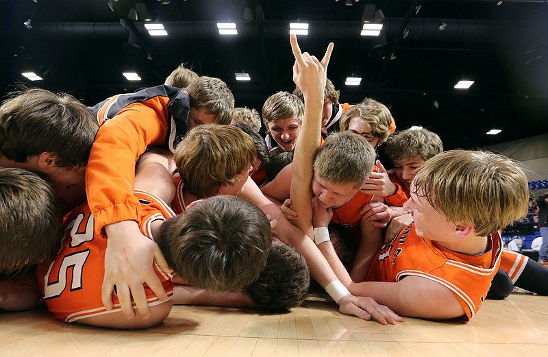 Viola Longhorns players dive onto the floor in celebration after Thursday night’s victory over Greers Ferry West Side in the Class 1A boys championship game at Bank OZK Arena in Hot Springs. More photos available at arkansasonline.com/319boys1a.
(Arkansas Democrat-Gazette/Thomas Metthe)