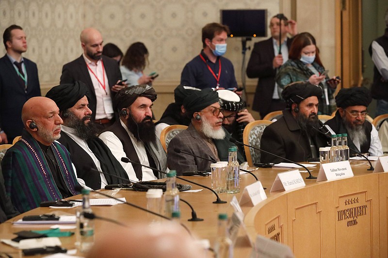 Former Afghan President Hamid Karzai (left) and Taliban co-founder Mullah Abdul Ghani Baradar (second from right) attend an international peace conference Thursday in Moscow.
(AP/Alexander Zemlianichenko)