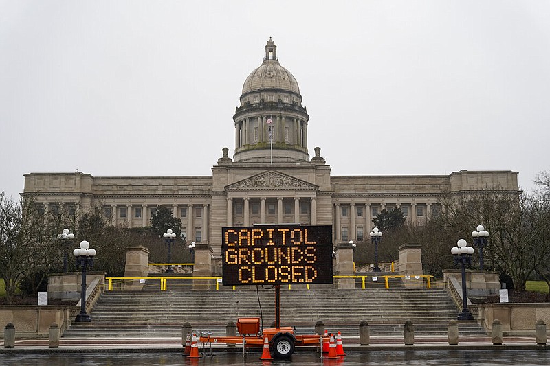 A sign displayed outside the Capitol building in Frankfort, Ky., on Sunday, Jan. 17, 2021, advises that the grounds are closed. (AP/Bryan Woolston)