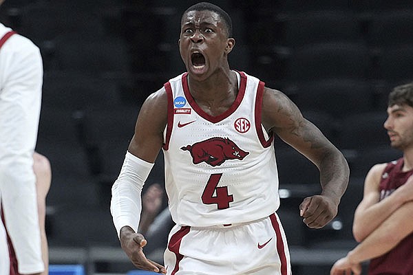Arkansas' Davonte Davis reacts to a last second basket to end the first half during a first round men's college basketball game against Colgate in the NCAA Tournament, Friday, March 19, 2021, at Bankers Life Fieldhouse in Indianapolis. (Jack Dempsey/Pool Photo via AP) Arkansas' Davonte Davis reacts to a last second basket to end the first half during a first round men's college basketball game against Colgate in the NCAA Tournament, Friday, March 19, 2021, at Bankers Life Fieldhouse in Indianapolis. (Jack Dempsey/Pool Photo via AP)