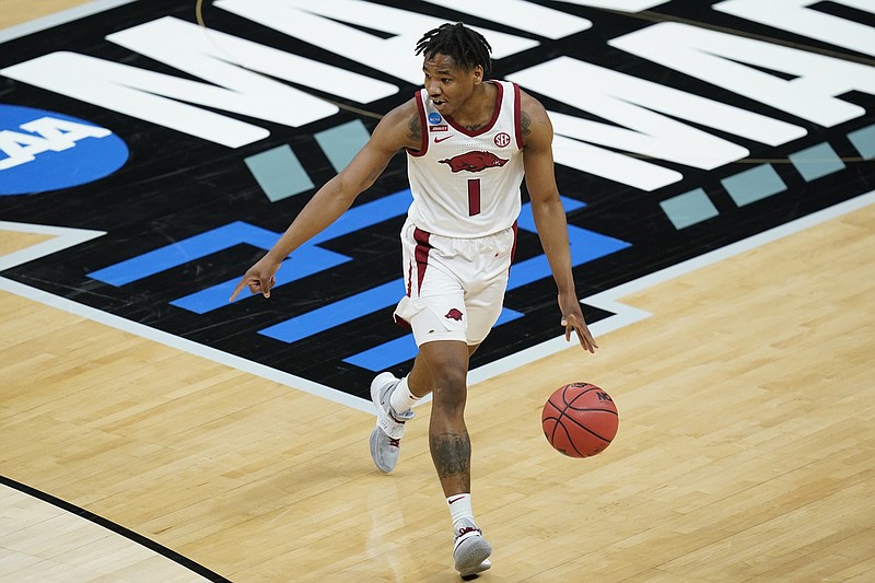 Arkansas' JD Notae (1) dribbles during the second half of a first round game against Colgate at Bankers Life Fieldhouse in the NCAA men's college basketball tournament, Friday, March 19, 2021, in Indianapolis. (AP Photo/Darron Cummings)