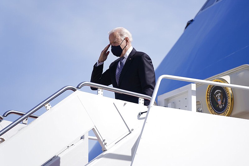 President Joe Biden boards Air Force One at Andrews Air Force Base, Md., Friday, March 19, 2021. Biden is en route to Georgia. (AP/Patrick Semansky)