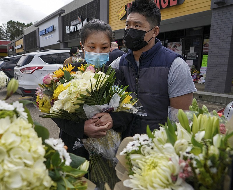 Jami Webb and her fiance, Kevin Chen, on Friday mourn Webb’s mother, Xiaojie Tan, who owned Young’s Asian Massage and waskilled in Tuesday’s shootings in Acworth, Ga. More photos at arkansasonline.com/320atlanta/.
(The New York Times/Chang W. Lee)